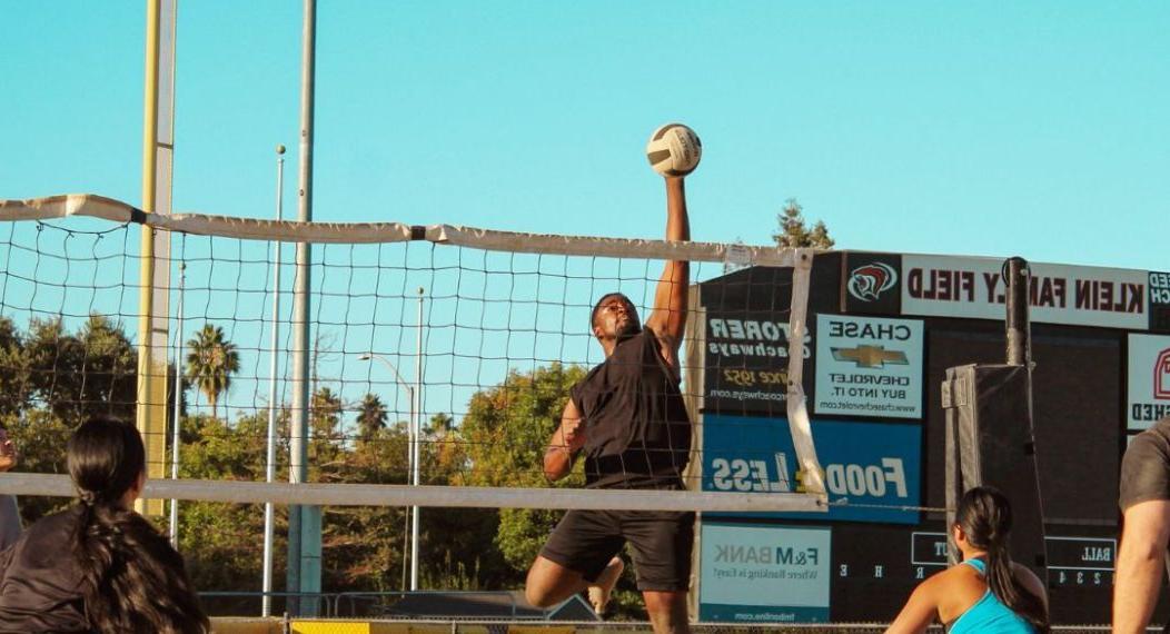 students playing volleyball